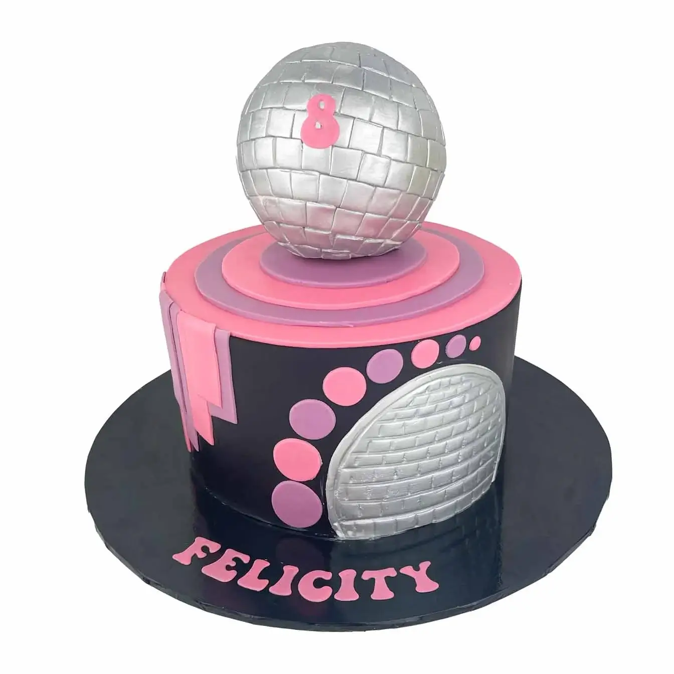 Disco Fever Cake - Black iced cake with cutout polka dots, topped with a molded disco ball and featuring a side cutout disco ball, perfect for a disco-themed celebration.