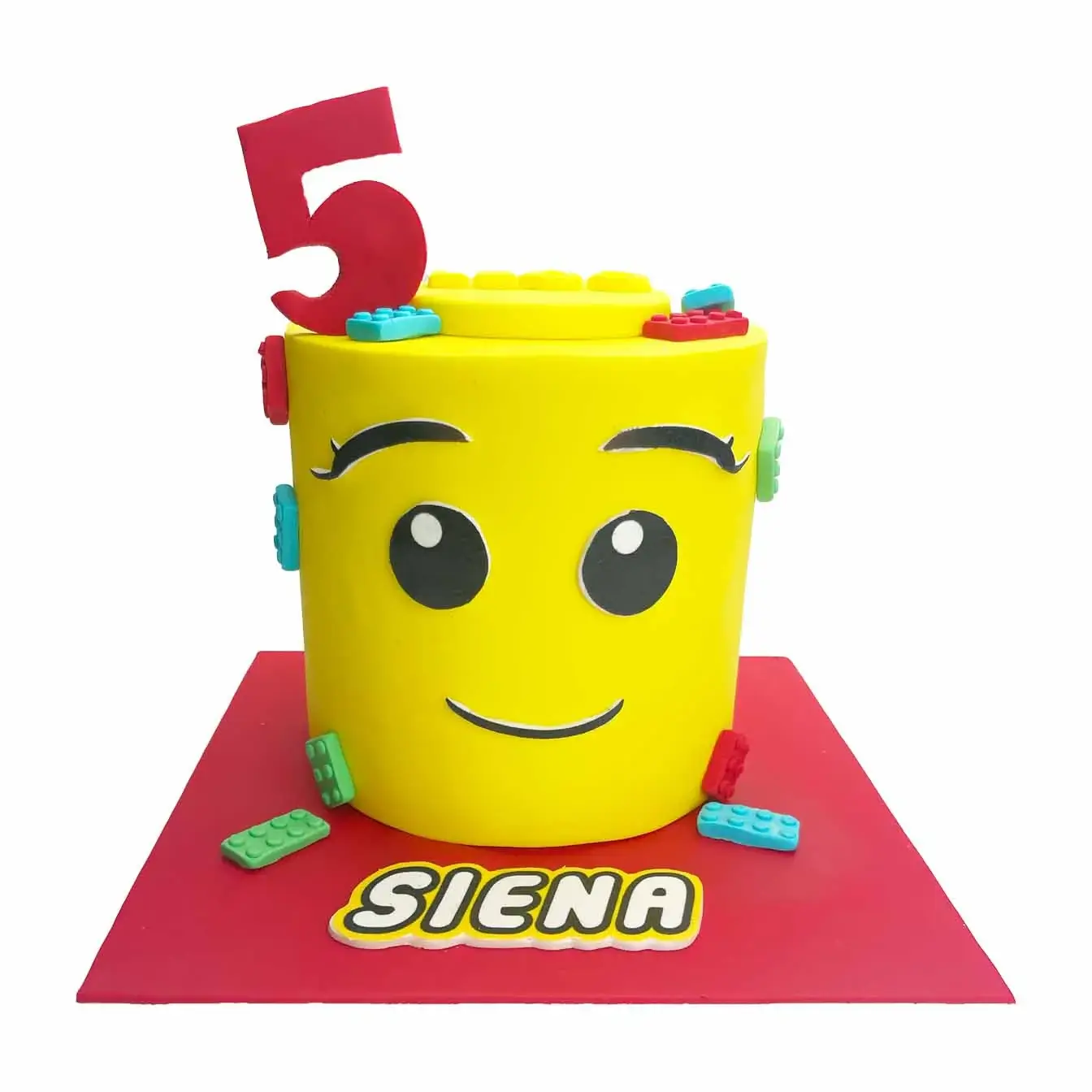 Build-A-Block Lego Head Cake - A delightful girl Lego head with cascading Lego bricks, a playful centerpiece for Lego enthusiasts.