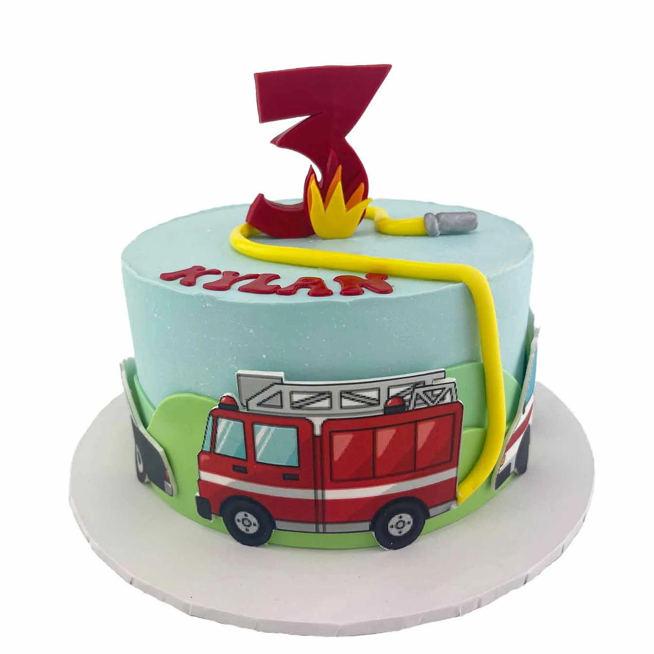 Fire Brigade Hero Cake - A blue iced cake with age and flames, a fire hose, and edible images of a fire truck and transport vehicles, a captivating centrepiece for firefighting enthusiasts and birthday celebrations.